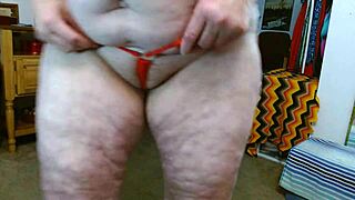 WATCH this mature ASS SPREAD in a short THONG panty parade!