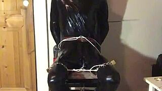 TRIM MASKED LATEX BONDED IN HANDCUFFS COSTUME PLAY