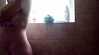 pregnant babe suds up for smooth shower shave tease