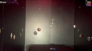 prostitute takes big black cocks through gloryhole in red room