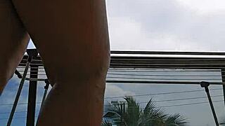 check out this naughty maid flashing her big ass from the balcony