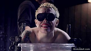 Tied Up Short-Haired Blonde in Bizarre Device Bondage