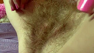 check out this muscular babe rubbing her monster hairy pussy to orgasm