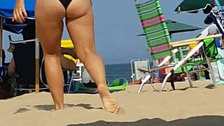 candid shots catch this bikini slut teasing ass on beach