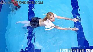 Ashlee Rose struts her sexy skinny wetlook by the pool.