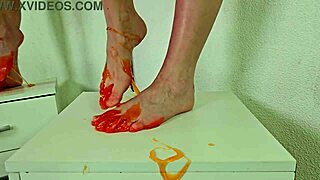 Neighbor teen Alice Klay's pretty shaved pussy and barefoot feet in orange slime close-up