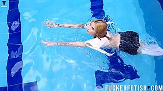 Ashlee Rose struts her sexy skinny wetlook by the pool.