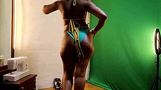 Sun flower tries on sexy bikinis showing off her oiled milf curves
