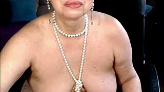 Watch this charming mature self-fist her sweet pussy up close.