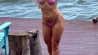 micro bikini barely covers her curves