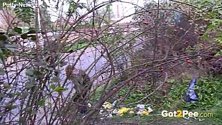 Pretty girl pees outdoors in nature during a solo moment