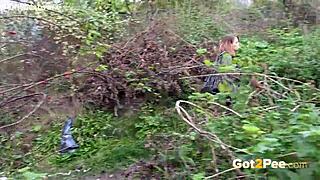 Pretty girl pees outdoors in nature during a solo moment