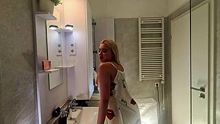 super hot sexy blonde college girl in a satin nightie prepares for the night in the bathroom